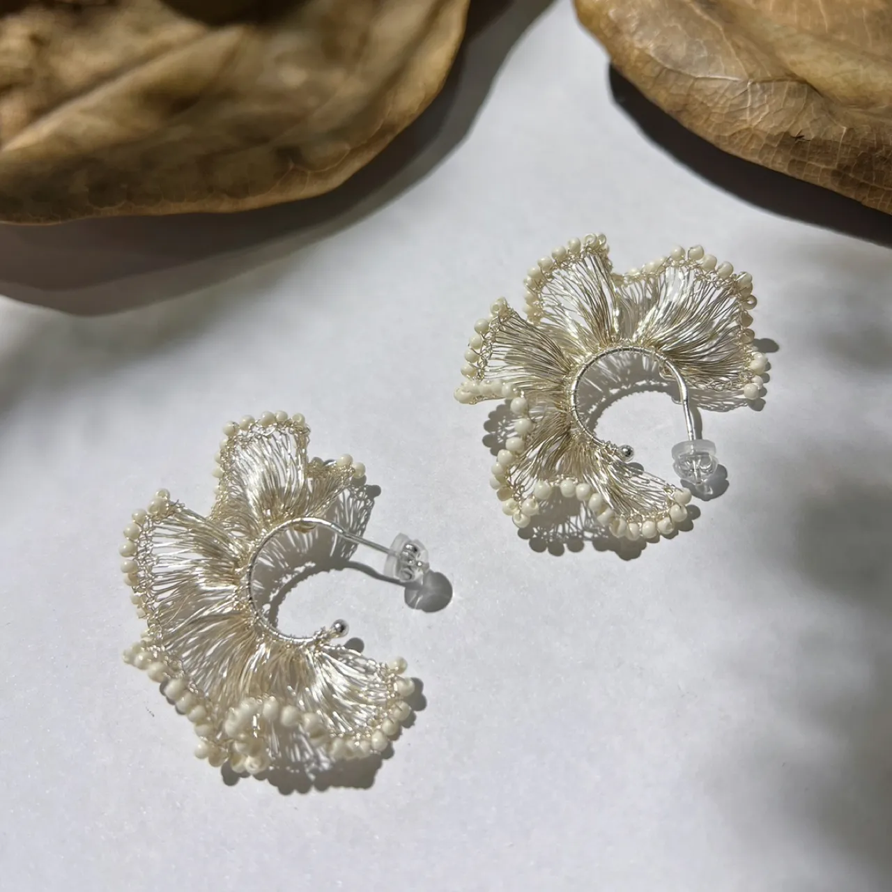 Ivory beaded silver-tone ginkgo hoop earrings