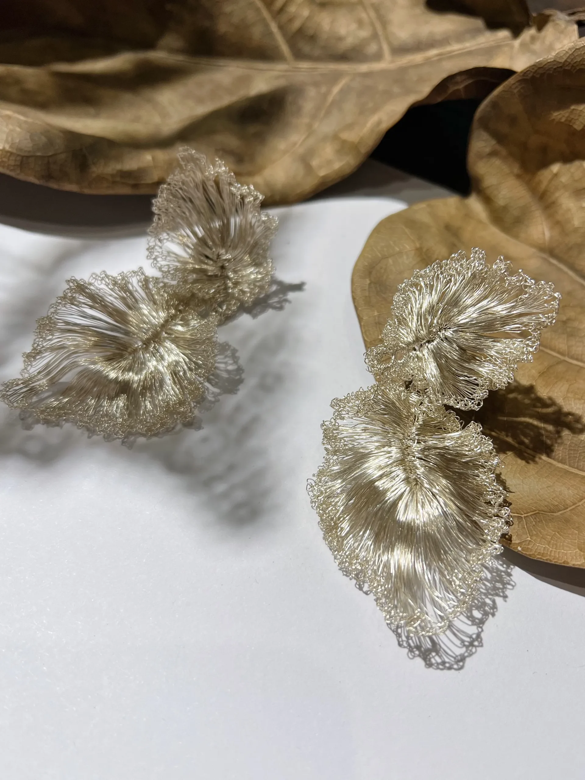 Pair of sculptural handwoven ginkgo leaf earrings