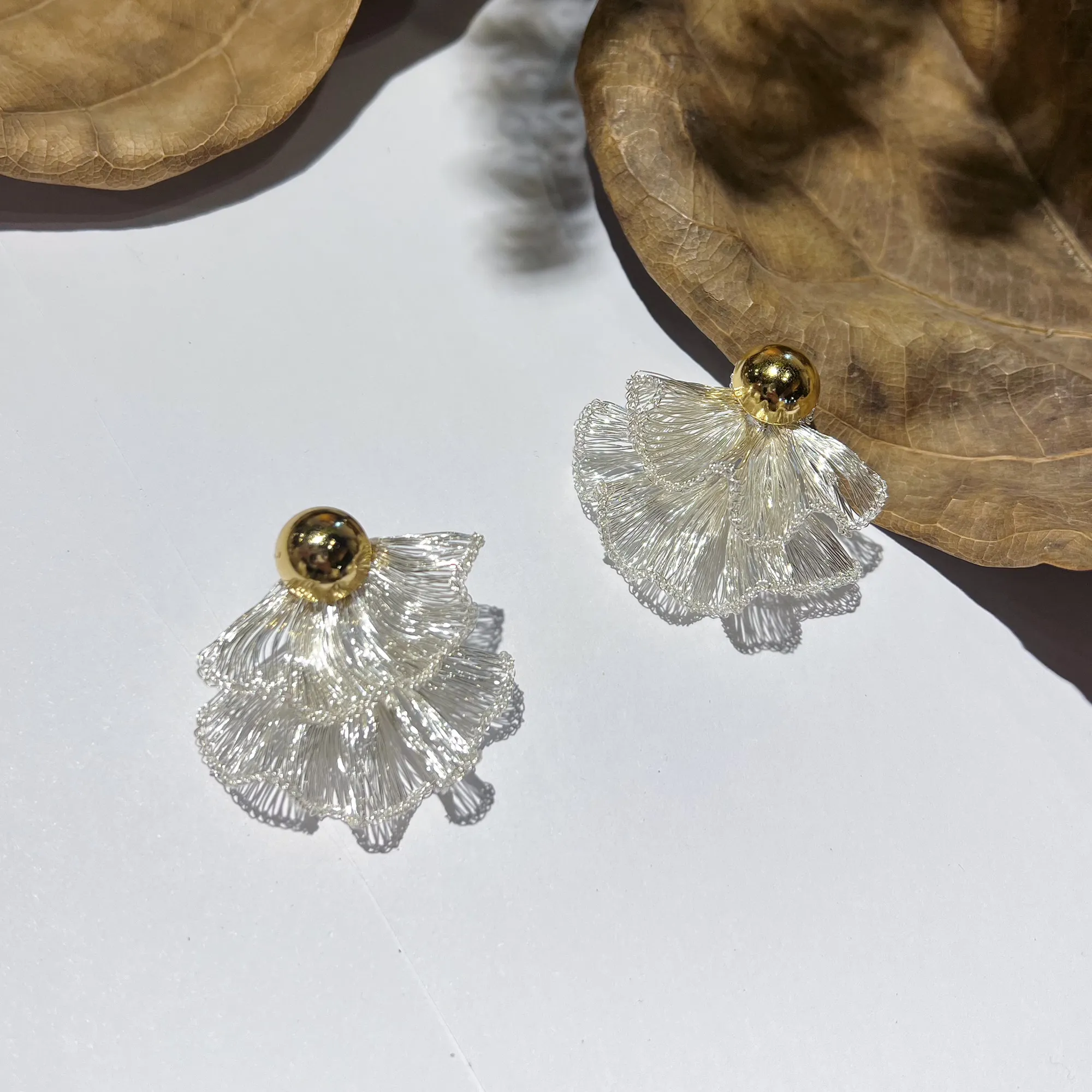 Handwoven layered silver-tone wire fan statement earrings