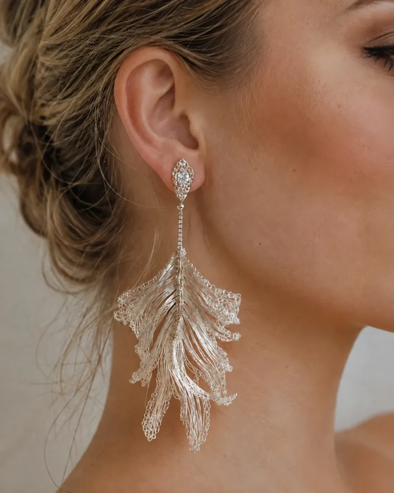 Close-up model view of OREYNE Skeleton Leaf drop earrings