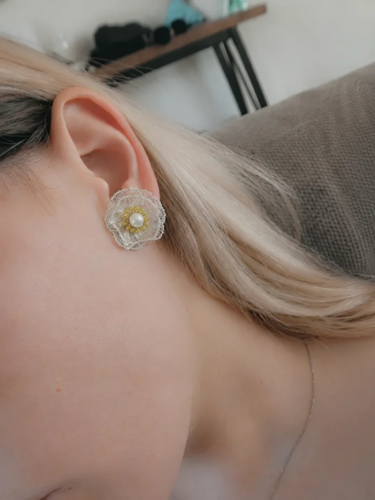 OREYNE Botanical White Poppy Jewelry worn on model