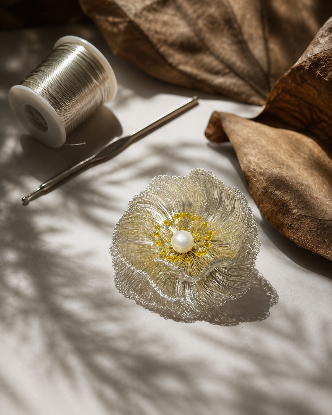Metal wire, crochet hook and a hand-shaped OREYNE flower form