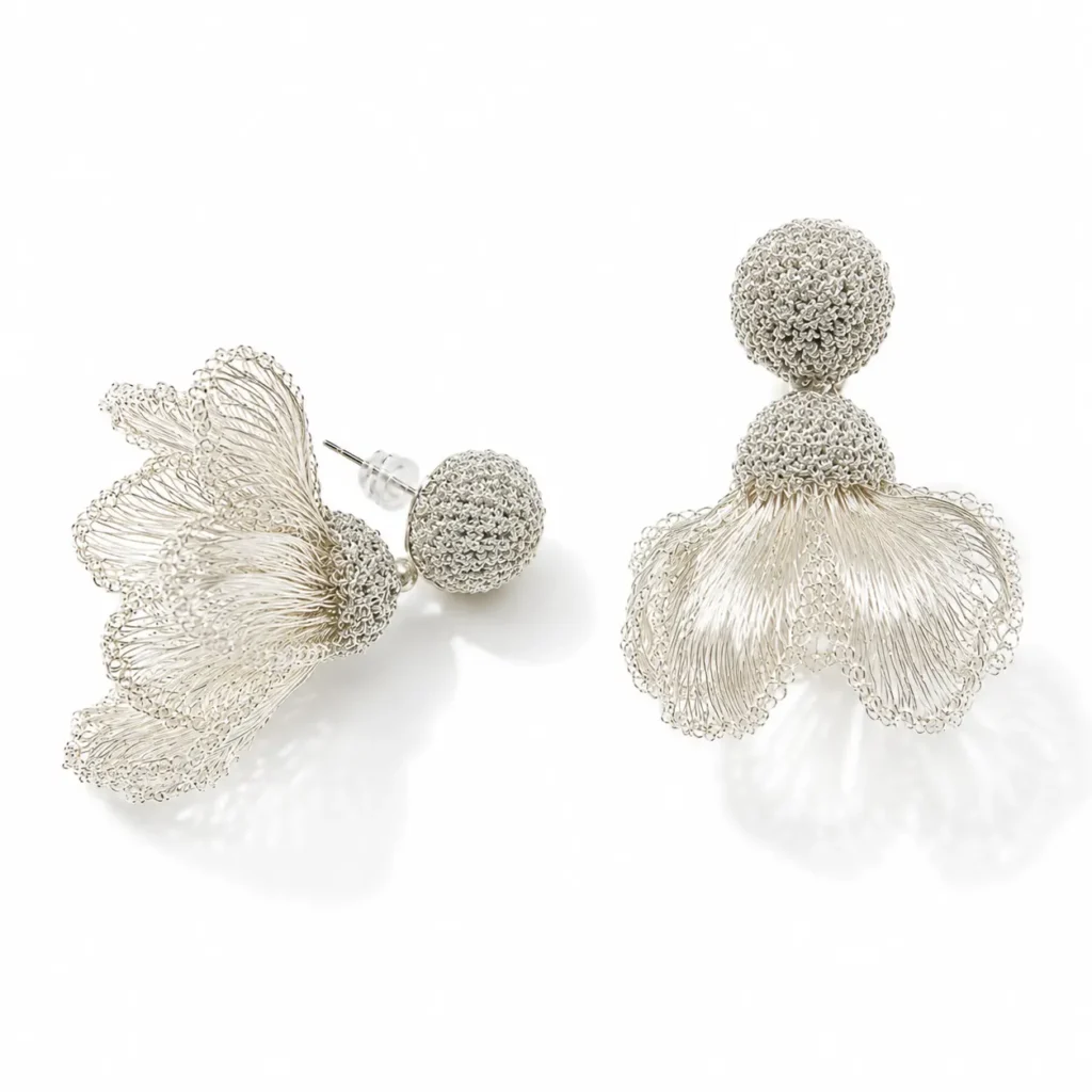 OREYNE handcrafted silver wire floral drop earrings with textured woven studs on a white background