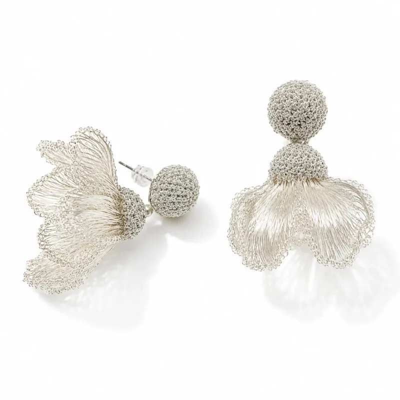 OREYNE handcrafted silver wire floral drop earrings with textured woven studs on a white background