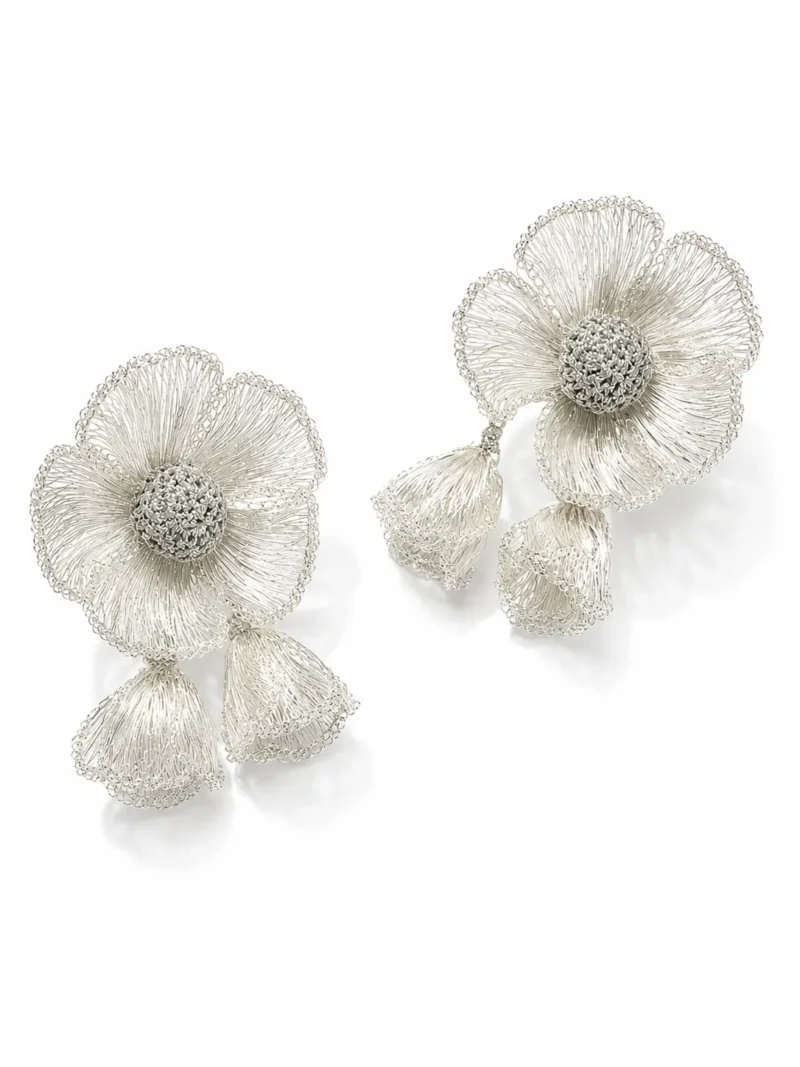 OREYNE handcrafted silver wire flower drop earrings with textured woven centers on a white background
