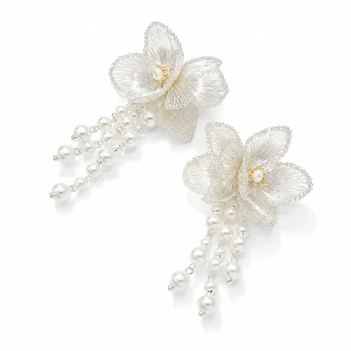 OREYNE handcrafted silver wire flower chandelier earrings with pearl tassels on a white background