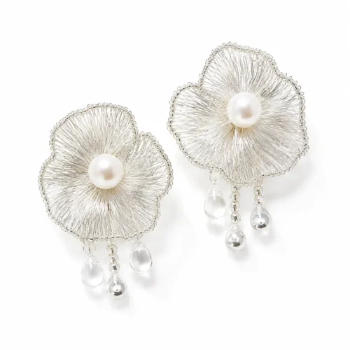 OREYNE handcrafted silver wire flower drop earrings with pearl centers and clear teardrop details on a white background