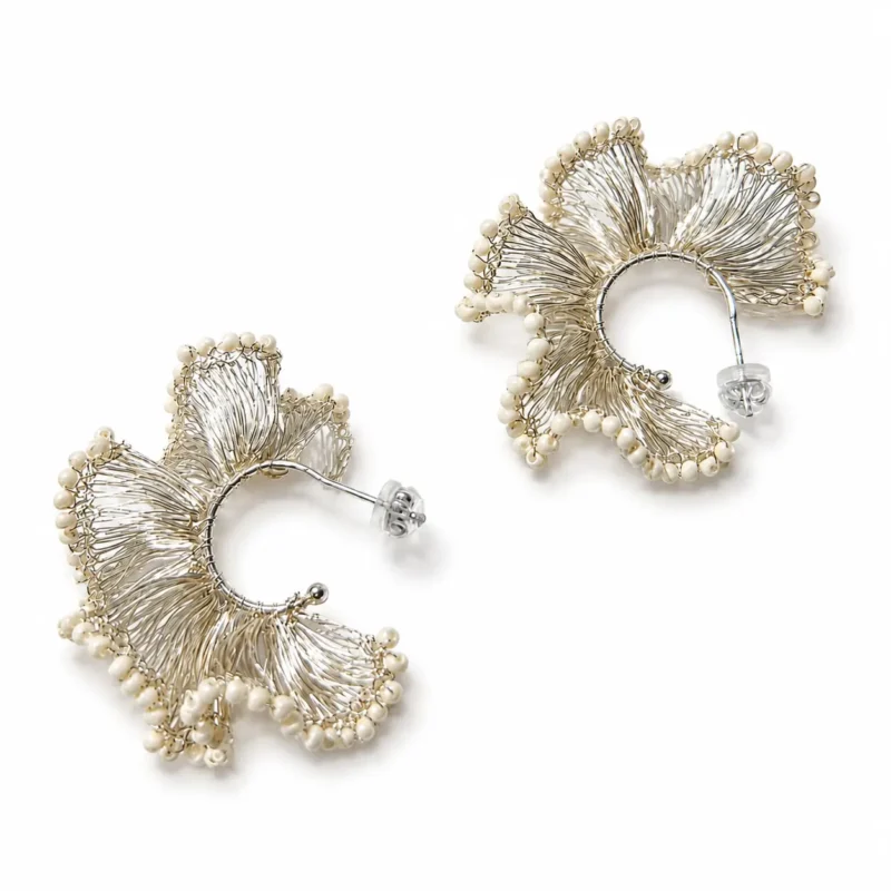 OREYNE handcrafted silver wire flower earrings with pearl details on a white background