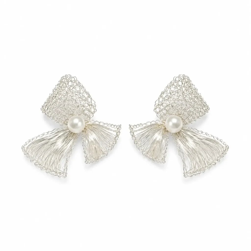 OREYNE handcrafted silver wire sculptural earrings with pearl centers on a white background