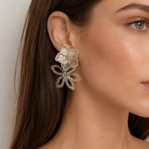 Woman wearing OREYNE Water Lily double flower earrings