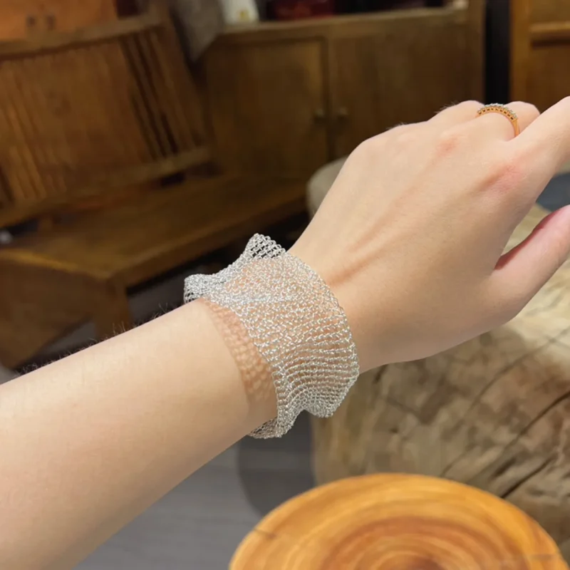OREYNE handwoven Fine Silver-Plated Copper Wire mesh cuff bracelet worn on wrist