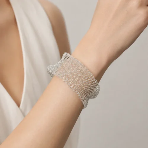 Model wearing OREYNE silver-tone Hoarfrost Mesh cuff bracelet