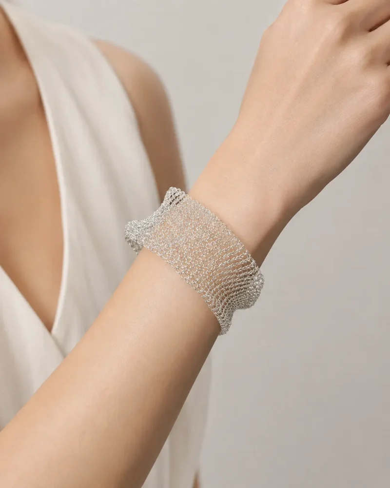 Model wearing OREYNE silver-tone Hoarfrost Mesh cuff bracelet
