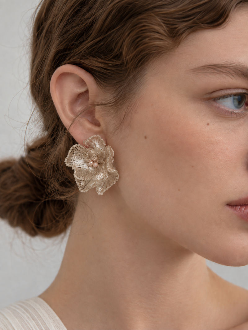 Model wearing OREYNE Cotton Rose sculptural stud earrings