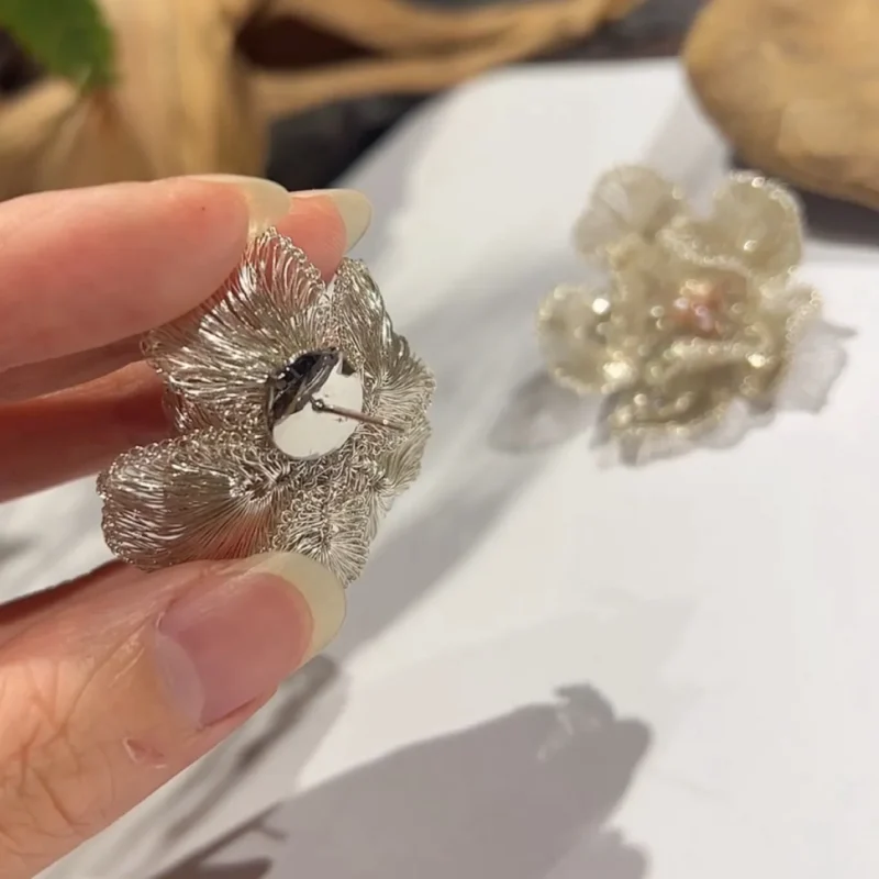 Back detail of OREYNE Cotton Rose sculptural stud earrings