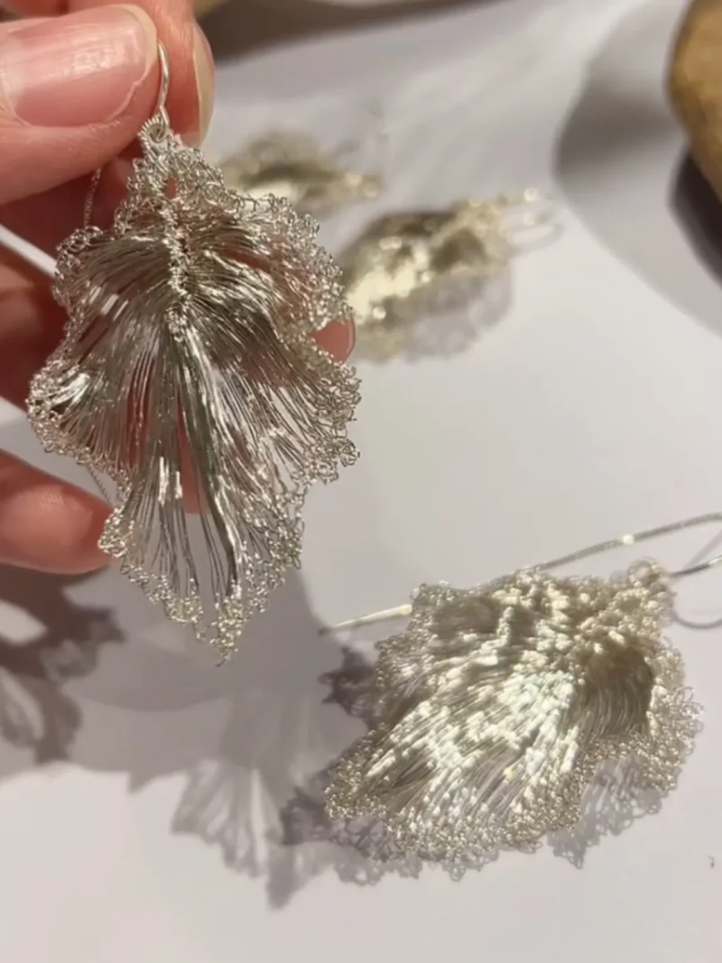 Handcrafted detail of OREYNE Ruffled Leaf drop earrings