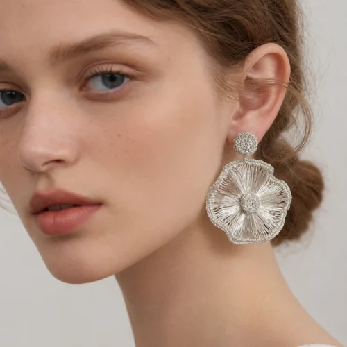 Model wearing OREYNE Radiant Bloom statement earrings