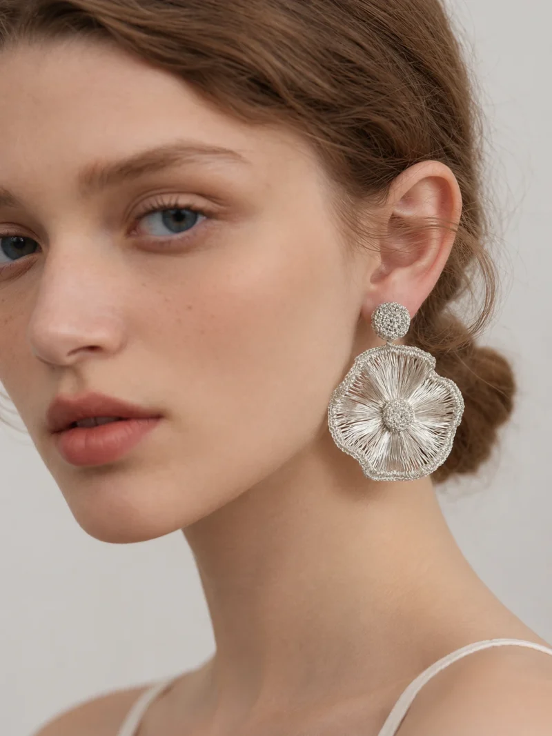 Model wearing OREYNE Radiant Bloom statement earrings