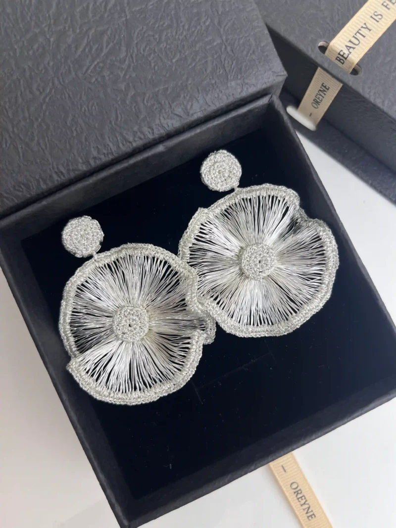 OREYNE Radiant Bloom statement earrings in jewelry box