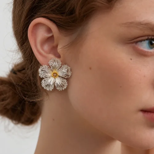 Model wearing OREYNE White Strawberry Blossom stud earrings