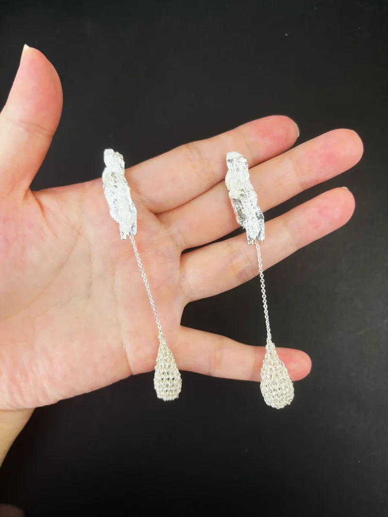 OREYNE Dewdrop Bud earrings shown in hand
