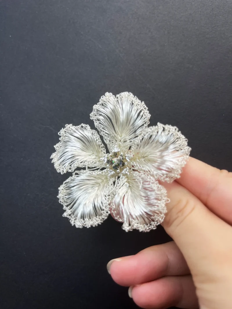 Close-up of OREYNE White Blossom sculptural brooch