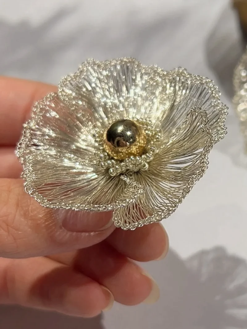 Close-up detail of OREYNE White Poppy sculptural flower earrings