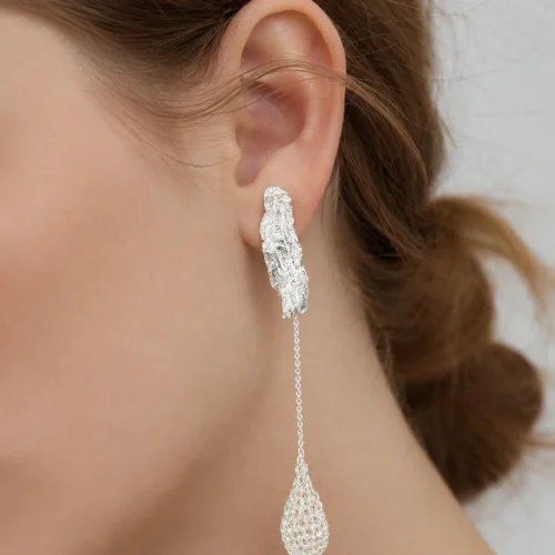 Model wearing OREYNE Dewdrop Bud long drop earrings