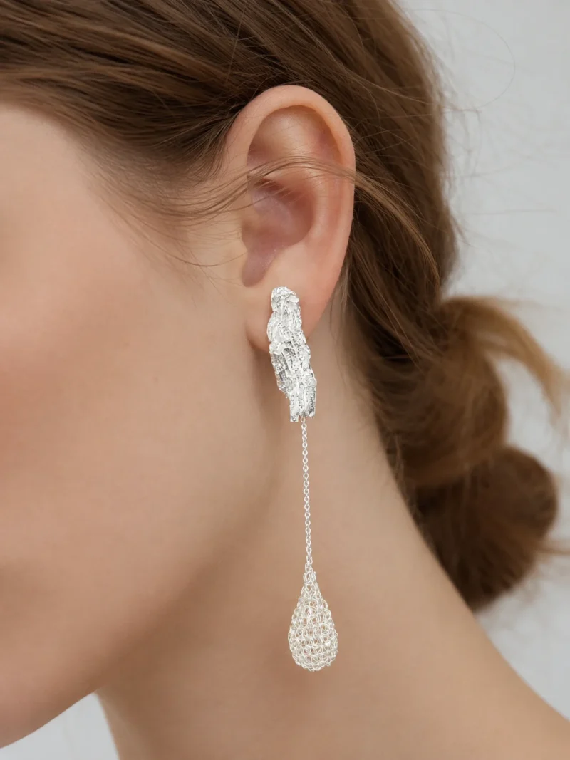 Model wearing OREYNE Dewdrop Bud long drop earrings