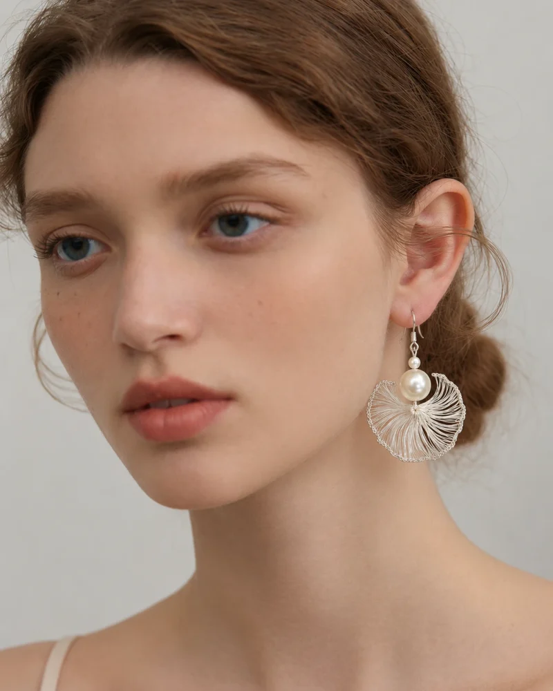 Model wearing Ginkgo Leaf Pearl Fan Earrings