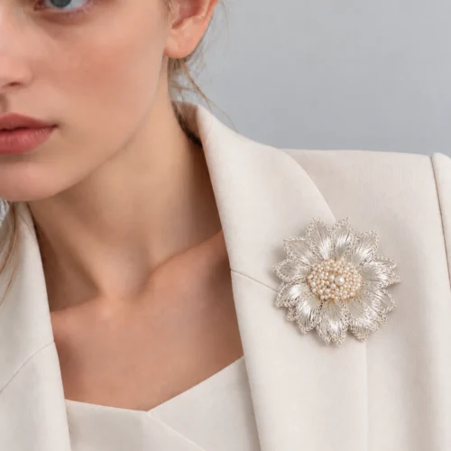 Model wearing White Chrysanthemum Luminous Heart Brooch