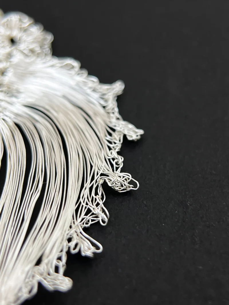 Close-up of the open wire edge of a bodhi leaf earring